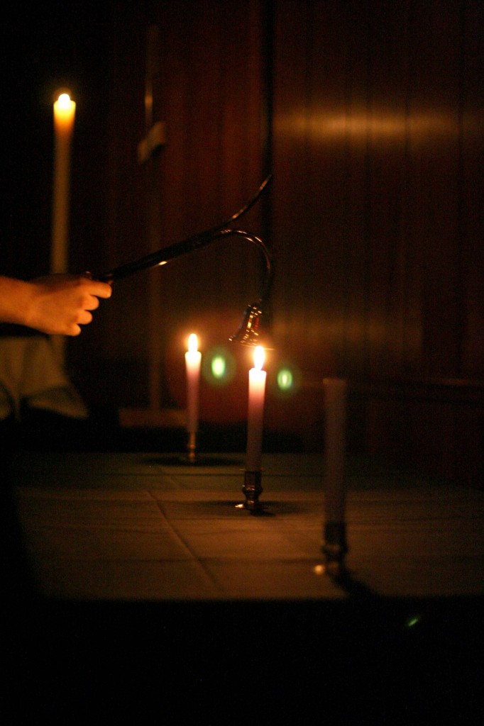 As each candle is exstinguished, the shadow of darkness gets stronger representing the decent into the crucifixion./Triangle photo by Lana Douglas