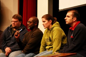 Panel answers student's questions about new apartments in a meeting last Tuesday night. 