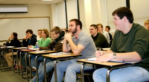 Students laugh at a comment made by Roddy Llewellyn in Col. Pettite's Strategies & Tactics Class.  Photo courtesy of Faith Ammen.