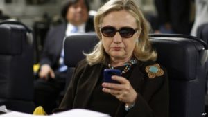 Hillary Clinton on he r Blackberry.
